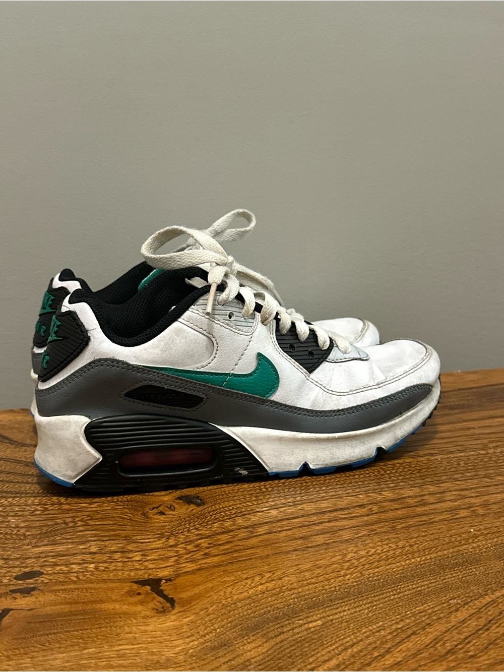 Kids Nike White and Black Athletic Sneakers with Teal Accent